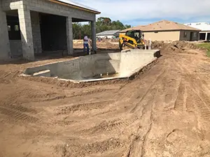 pool construction: grade and plumb
